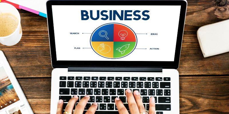 hands typing on a laptop